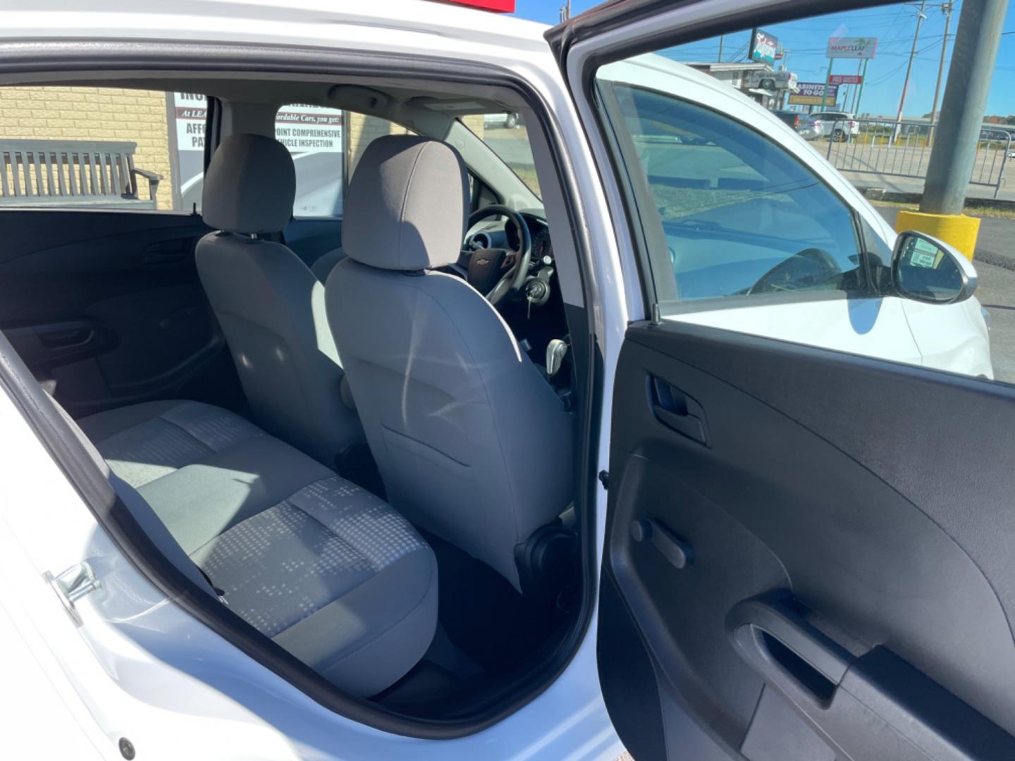 2017 White Chevrolet Sonic (1G1JG6SH2H4) with an 4-Cyl, 1.8 Liter engine, Automatic, 6-Spd transmission, located at 8008 Warden Rd, Sherwood, AR, 72120, (501) 801-6100, 34.830078, -92.186684 - Photo#9